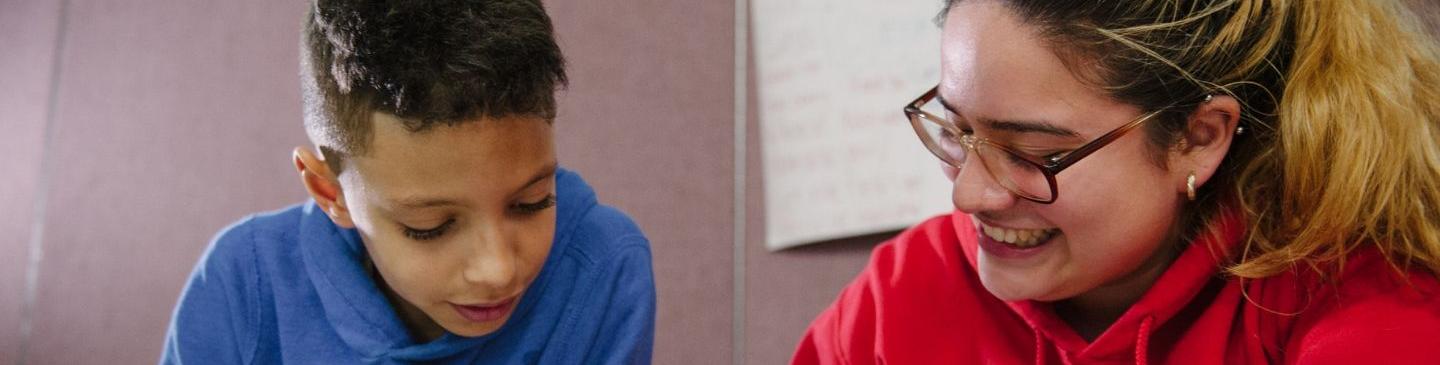 Boy and young woman mentor