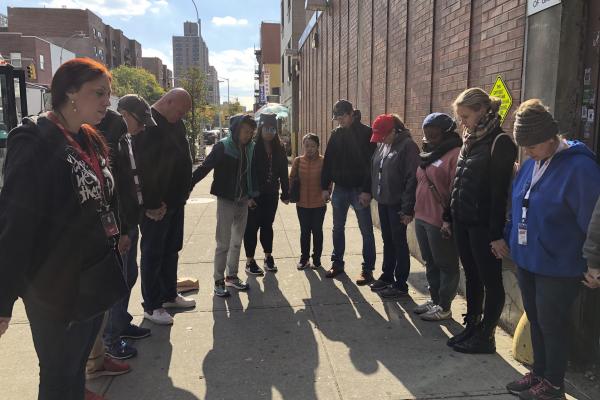 NYC Relief HFNY volunteers praying